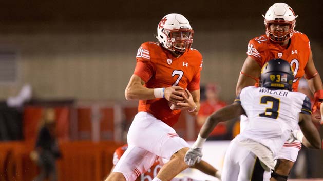 Oct 10, 2015; Salt Lake City, UT, USA; Utah Utes quarterback Travis Wilson (7) runs with the ball as California Golden Bears cornerback Cameron Walker (3) defends during the first quarter at Rice-Eccles Stadium. Mandatory Credit: Russ Isabella-USA TODAY Sports