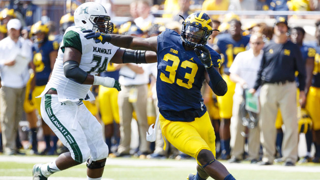 Sep 3, 2016; Ann Arbor, MI, USA; Michigan Wolverines defensive end Taco Charlton (33) rushes on Hawaii Warriors offensive lineman RJ Hollis (74) at Michigan Stadium. Photo Credit: Rick Osentoski-USA TODAY Sports