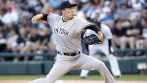 Tanaka tames White Sox; Yankees get 20 hits in win