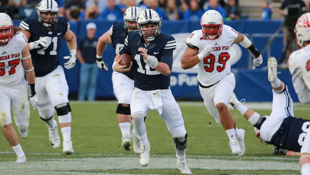 Nov 12, 2016; Provo, UT, USA; Brigham Young Cougars quarterback Tanner Mangum (12) runs the ball up the field against the Southern Utah Thunderbirds during the fourth quarter at Lavell Edwards Stadium. Brigham Young Cougars won the game 37 to 7. Photo Credit: Chris Nicoll-USA TODAY Sports