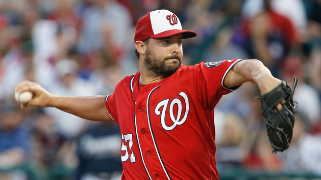 Mar 12, 2016; Lake Buena Vista, FL, USA; Washington Nationals relief pitcher Tanner Roark (57) throws during the first inning of a spring training baseball game against the Atlanta Braves at Champion Stadium. Mandatory Credit: Reinhold Matay-USA TODAY Sports