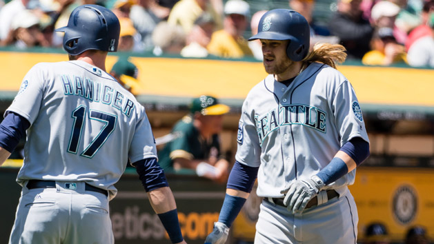 Apr 23, 2017; Oakland, CA, USA; Seattle Mariners shortstop Taylor Motter (21) high fives right fielder Mitch Haniger (17) after hitting a grand slam home run against the Oakland Athletics during the third inning at Oakland Coliseum. Photo Credit: Kelley L Cox-USA TODAY Sports