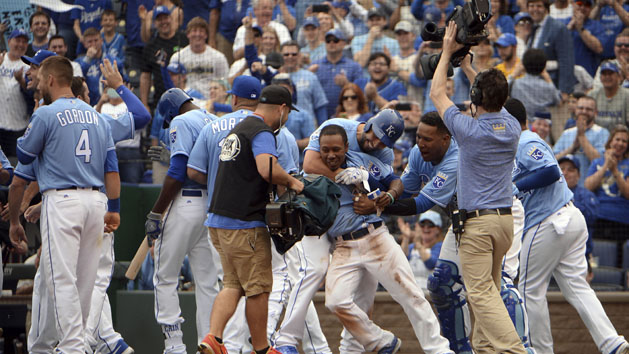 Apr 10, 2016; Kansas City, MO, USA; Kansas City Royals pinch runner Terrance Gore (0) is congratulated by the team after scoring from third base on a wild pitch by the Minnesota Twins in the tenth inning at Kauffman Stadium. Mandatory Credit: John Rieger-USA TODAY Sports