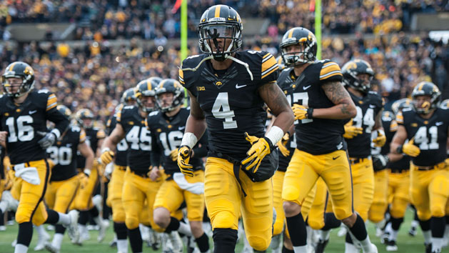 Oct 31, 2015; Iowa City, IA, USA; Iowa Hawkeyes wide receiver Tevaun Smith (4) and teammates enter the field before the game against the Maryland Terrapins at Kinnick Stadium. Mandatory Credit: Jeffrey Becker-USA TODAY Sports