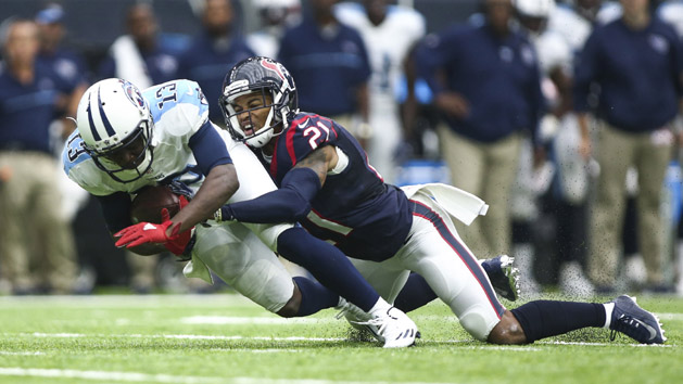 Oct 2, 2016; Houston, TX, USA; Tennessee Titans wide receiver Kendall Wright (13) makes a reception as Houston Texans cornerback A.J. Bouye (21) defends during the fourth quarter at NRG Stadium. The Texans won 27-20. Photo Credit: Troy Taormina-USA TODAY Sports