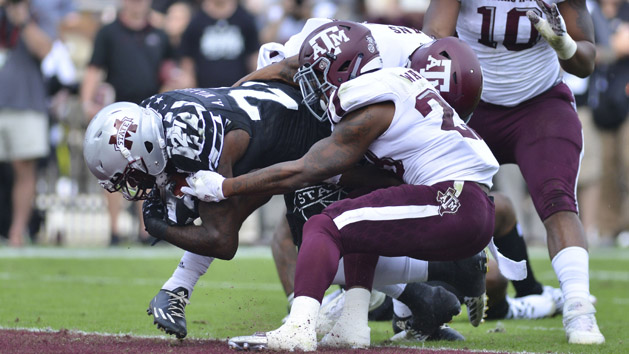 Nov 5, 2016; Starkville, MS, USA; Mississippi State Bulldogs running back Aeris Williams (27) dives into the end zone defended by Texas A&M Aggies defensive back Armani Watts (23) during the first quarter of the game at Davis Wade Stadium. Photo Credit: Matt Bush-USA TODAY Sports