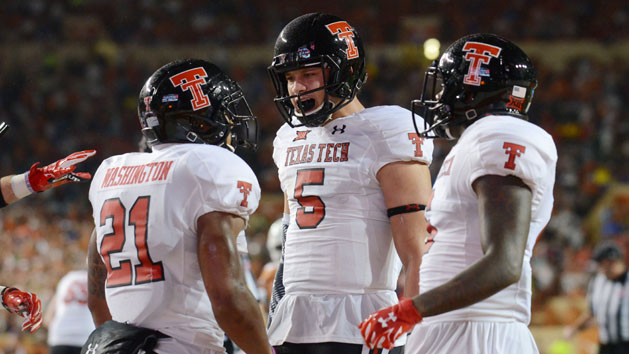 Nov 26, 2015; Austin, TX, USA; Texas Tech Red Raiders running back DeAndre Washington (21) and quarterback Patrick Mahomes II (5) react against the Texas Longhorns during the second half at Darrell K Royal-Texas Memorial Stadium. Texas Tech beat Texas 48-45. Mandatory Credit: Brendan Maloney-USA TODAY Sports