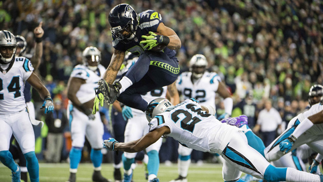 Dec 4, 2016; Seattle, WA, USA; Seattle Seahawks running back Thomas Rawls (34) leaps over Carolina Panthers cornerback Daryl Worley (26) for a touchdown during the first quarter at CenturyLink Field. Photo Credit: Troy Wayrynen-USA TODAY Sports