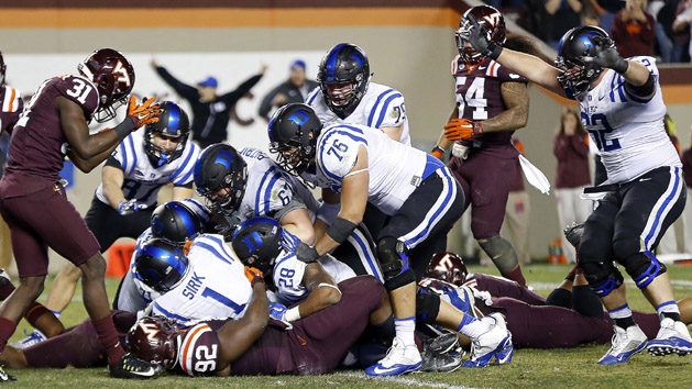 Oct 24, 2015; Blacksburg, VA, USA; Duke Blue Devils quarterback Thomas Sirk (1) scores the game-winning two point conversion as Virginia Tech Hokies defensive tackle Luther Maddy (92) defends in quadruple overtime at Lane Stadium. The Blue Devils won 45-43 in quadruple overtime. Photo Credit: Geoff Burke-USA TODAY Sports