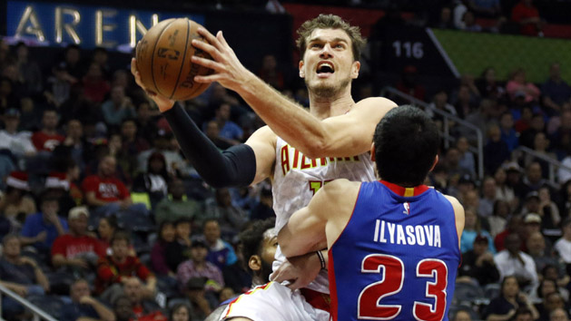 Dec 23, 2015; Atlanta, GA, USA; Atlanta Hawks center Tiago Splitter (11) shoots over Detroit Pistons forward Ersan Ilyasova (23) in the fourth quarter at Philips Arena. The Hawks defeated the Pistons 107-100. Mandatory Credit: Brett Davis-USA TODAY Sports