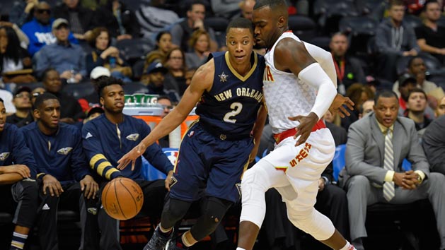 Nov 22, 2016; Atlanta, GA, USA; New Orleans Pelicans guard Tim Frazier (2) dribbles against the defense of Atlanta Hawks forward Paul Millsap (4) during the first half at Philips Arena. Photo Credit: Dale Zanine-USA TODAY Sports
