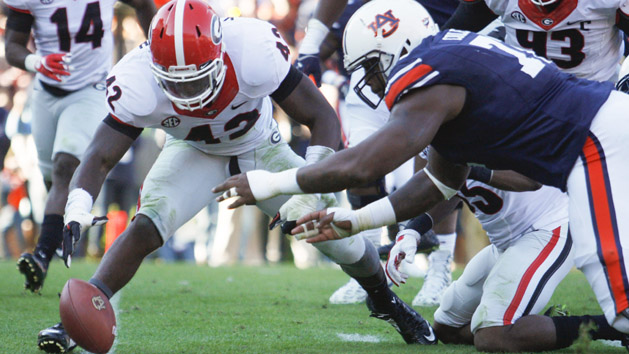 Nov 14, 2015; Auburn, AL, USA; Georgia Bulldogs linebacker Tim Kimbrough (42) and Auburn Tigers lineman Shon Coleman (72) reach for a fumble on the goal line during the fourth quarter at Jordan Hare Stadium. The Bulldogs recovered and beat the Tigers 20-13. Photo Credit: John Reed-USA TODAY Sports