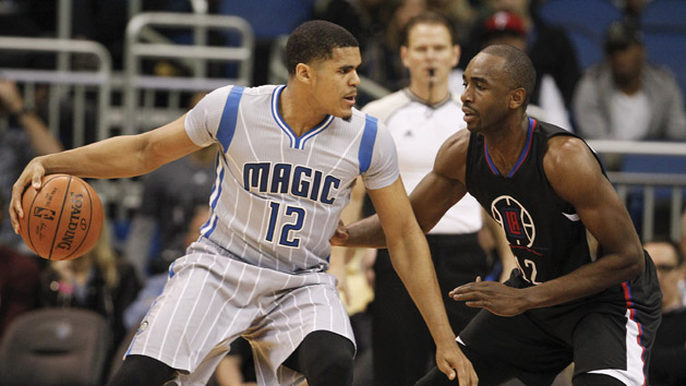 Feb 5, 2016; Orlando, FL, USA; Orlando Magic forward Tobias Harris (12) drives into Los Angeles Clippers forward Luc Richard Mbah a Moute (right) during the first quarter of a basketball game at Amway Center. Mandatory Credit: Reinhold Matay-USA TODAY Sports