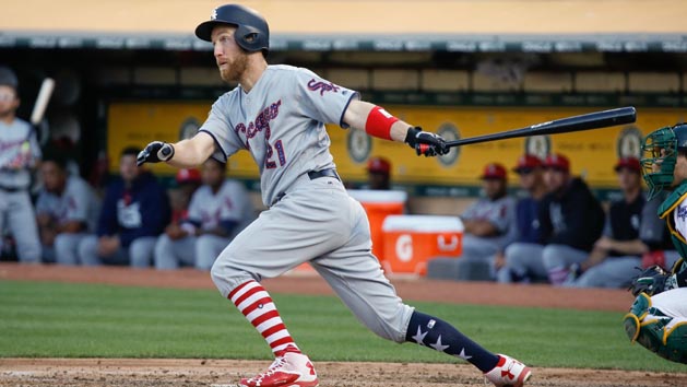 Jul 4, 2015; Cincinnati, OH, USA; Cincinnati Reds third baseman Todd Frazier hits a double in the ninth inning against the Milwaukee Brewers at Great American Ball Park. The Brewers won 7-3. Mandatory Credit: David Kohl-USA TODAY Sports