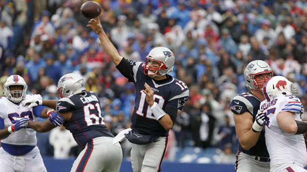 New England Patriots quarterback Tom Brady (12) looks for a receiver during training camp. Photo Credit: Winslow Townson-USA TODAY Sports