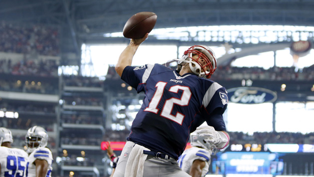 Oct 11, 2015; Arlington, TX, USA; New England Patriots quarterback Tom Brady (12) celebrates scoring a touchdown against the Dallas Cowboys at AT&T Stadium. Mandatory Credit: Erich Schlegel-USA TODAY Sports