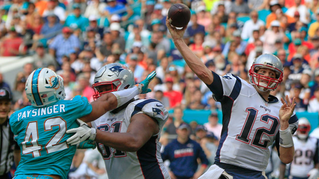 Jan 1, 2017; Miami Gardens, FL, USA; New England Patriots offensive tackle Marcus Cannon (61) holds back Miami Dolphins linebacker Spencer Paysinger (42) as Patriots quarterback Tom Brady (12) throws a pass during the second quarter of an NFL football game at Hard Rock Stadium. Photo Credit: Reinhold Matay-USA TODAY Sports