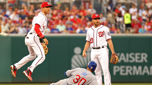 Jun 28, 2017; Washington, DC, USA; Washington Nationals shortstop Trea Turner (7) leaps over the slide of Chicago Cubs left fielder Jon Jay (30) after turning a double play in the fourth inning at Nationals Park. Photo Credit: Geoff Burke-USA TODAY Sports
