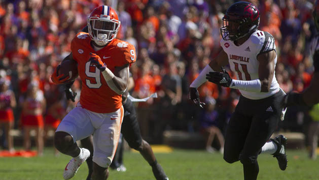 Nov 3, 2018; Clemson, SC, USA; Clemson Tigers running back Travis Etienne (9) avoids a tackle from Louisville Cardinals safety Dee Smith (11) during the first half at Clemson Memorial Stadium. Photo Credit: Joshua S. Kelly-USA TODAY Sports