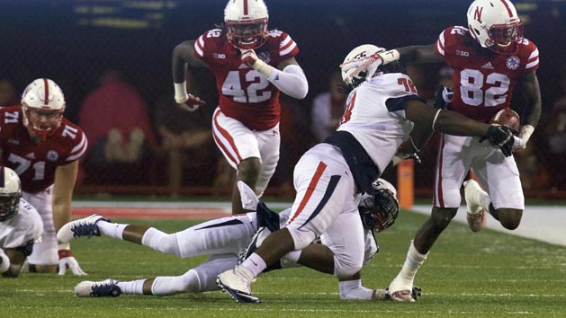 Sep 12, 2015; Lincoln, NE, USA; South Alabama Jaguars defensive lineman Tre Alford (78) tackles Nebraska Cornhuskers wide receiver Alonzo Moore (82) in the second half at Memorial Stadium. Nebraska won 48-9. Photo Credit: Bruce Thorson-USA TODAY Sports