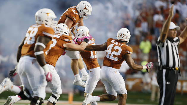 Oct 29, 2016; Austin, TX, USA; Texas Longhorns players celebrate with Trent Domingue (17) celebrates with teammates after his game-winning field goal to defend the Baylor Bears 35-34 at Darrell K Royal-Texas Memorial Stadium. Photo Credit: Erich Schlegel-USA TODAY Sports