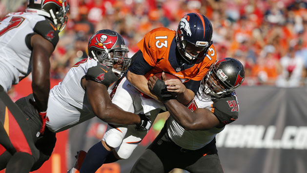 Oct 2, 2016; Tampa, FL, USA; Tampa Bay Buccaneers defensive tackle Akeem Spence (97) and defensive tackle Clinton McDonald (98) tackle Denver Broncos quarterback Trevor Siemian (13) during the first half at Raymond James Stadium. Photo Credit: Kim Klement-USA TODAY Sports