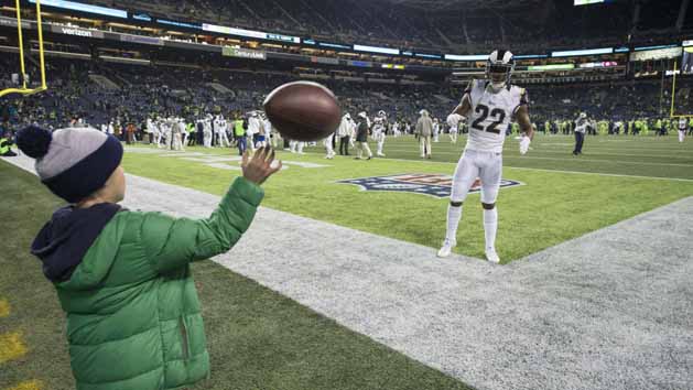 Dec 15, 2016; Seattle, WA, USA; Los Angeles Rams cornerback Trumaine Johnson (22) plays catch with a young Seattle Seahawks fan at CenturyLink Field. Photo Credit: Troy Wayrynen-USA TODAY Sports