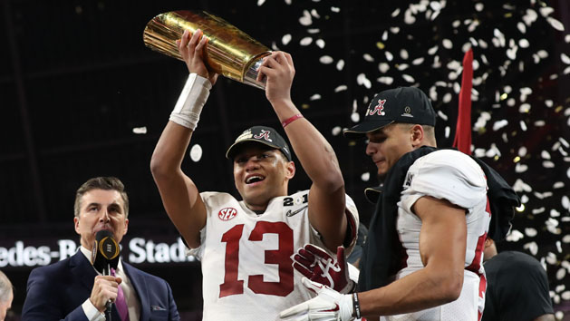 Jan 8, 2018; Atlanta, GA, USA; Alabama Crimson Tide quarterback Tua Tagovailoa (13) celebrates with the trophy after defeating the Georgia Bulldogs 26-23 in the 2018 CFP national championship college football game at Mercedes-Benz Stadium. Photo Credit: Matthew Emmons-USA TODAY Sports