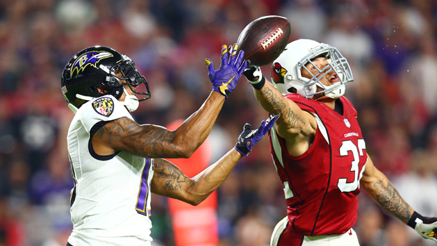 Oct 26, 2015; Glendale, AZ, USA; Arizona Cardinals safety Tyrann Mathieu (right) breaks up a pass intended for Baltimore Ravens wide receiver Chris Givens in the second quarter at University of Phoenix Stadium. Mandatory Credit: Mark J. Rebilas-USA TODAY Sports