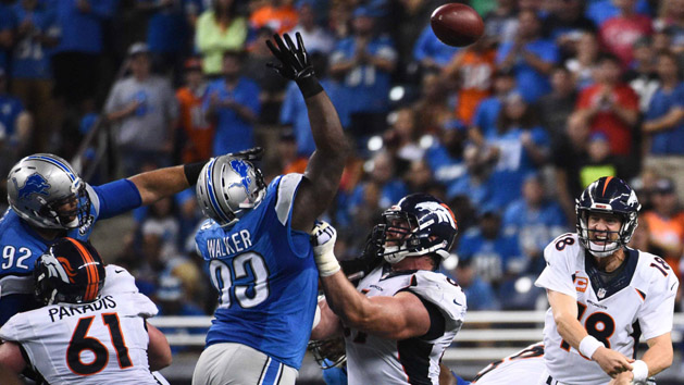 Sep 27, 2015; Detroit, MI, USA; Detroit Lions defensive tackle Tyrunn Walker (93) attempts to block the pass throw from Denver Broncos quarterback Peyton Manning (18) during the third quarter against the Detroit Lions at Ford Field. Mandatory Credit: Tim Fuller-USA TODAY Sports