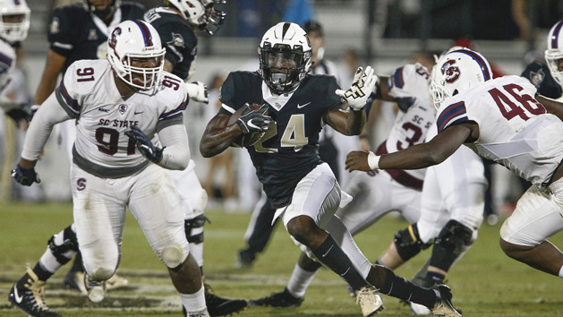 Sep 8, 2018; Orlando, FL, USA; UCF Knights running back Bentavious Thompson (24) runs between South Carolina State Bulldogs defensive lineman Roderick Perry (91) and linebacker Cornelius Walker (46) during the second half at Spectrum Stadium. Photo Credit: Reinhold Matay-USA TODAY Sports