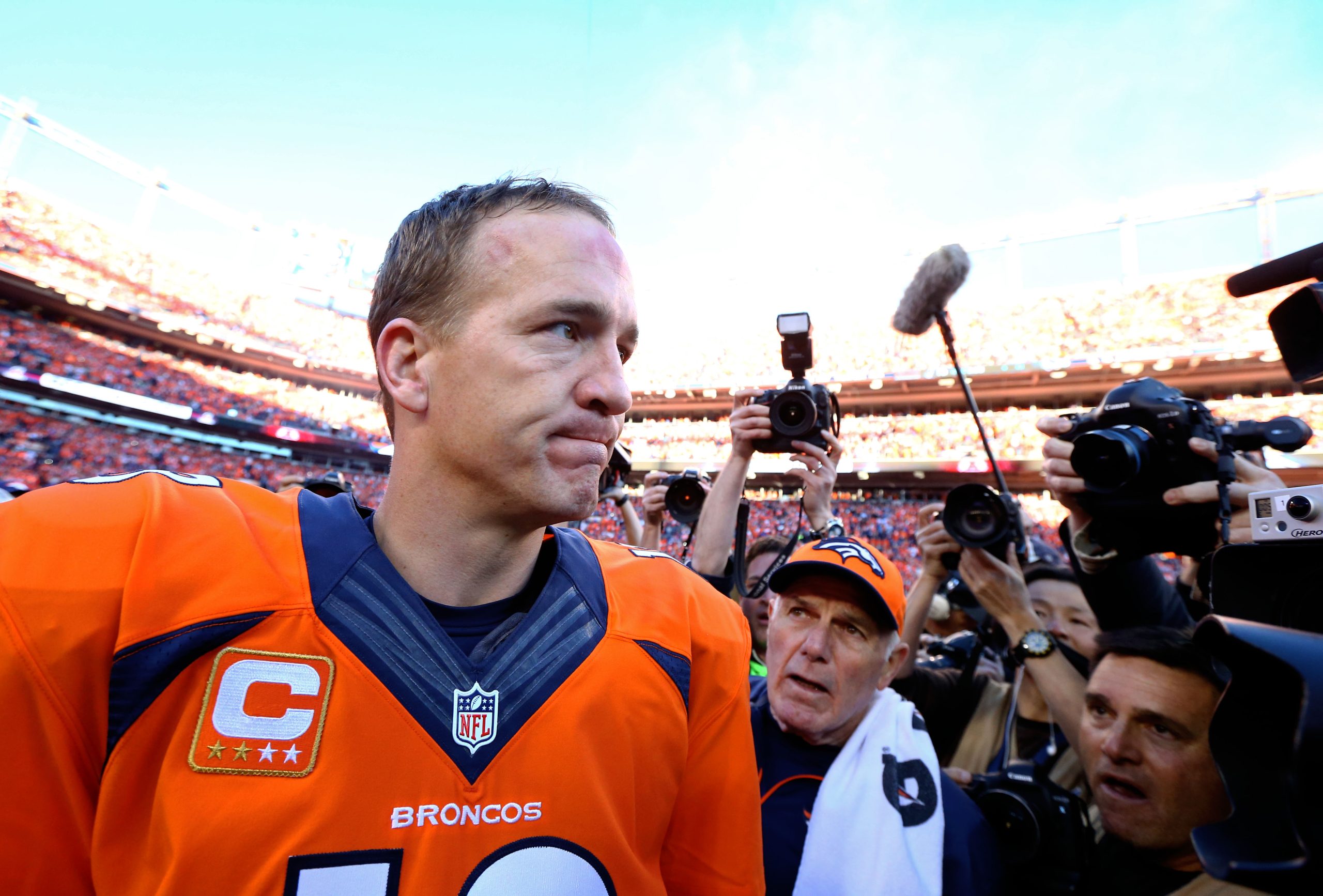 Jan 19, 2014; Denver, CO, USA; Denver Broncos quarterback Peyton Manning (18) following the game against the New England Patriots during the 2013 AFC Championship football game at Sports Authority Field at Mile High. Mark J. Rebilas-USA TODAY Sports