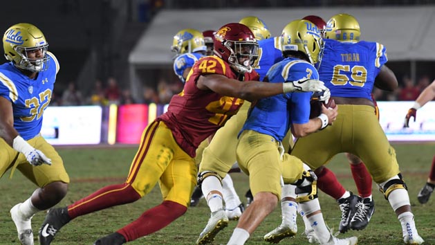 Nov 18, 2017; Los Angeles, CA, USA; UCLA Bruins quarterback Josh Rosen (3) is sacked by Southern California Trojans linebacker Uchenna Nwosu (42) in the second half at Los Angeles Memorial Coliseum. Photo Credit: Richard Mackson-USA TODAY Sports