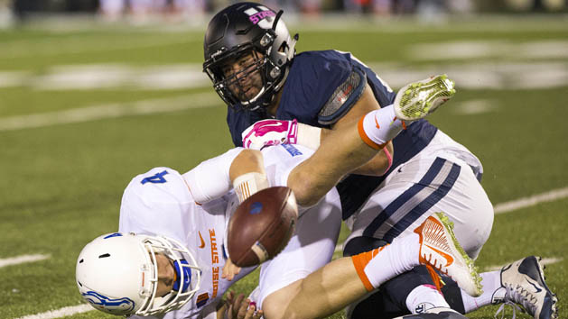 Oct 16, 2015; Logan, UT, USA; Boise State Broncos quarterback Brett Rypien (4) fumbles the ball forced by Utah State Aggies defensive end Ricky Ali'ifua (95) at Romney Stadium. Mandatory Credit: Rob Gray-USA TODAY Sports