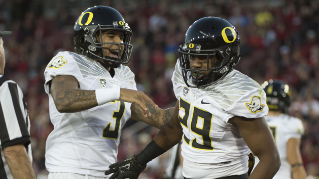 November 14, 2015; Stanford, CA, USA; Oregon Ducks running back Kani Benoit (29) is congratulated by quarterback Vernon Adams Jr. (3) for scoring a touchdown against the Stanford Cardinal during the first quarter at Stanford Stadium. Mandatory Credit: Kyle Terada-USA TODAY Sports