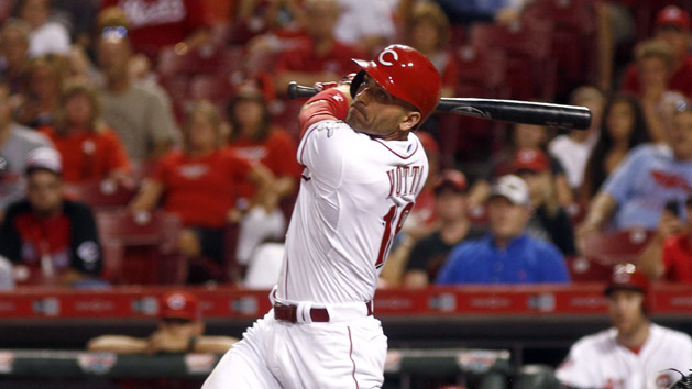 Sep 10, 2015; Cincinnati, OH, USA; Cincinnati Reds first baseman Joey Votto (19) hits a two-run double against the St. Louis Cardinals in the fifth inning at Great American Ball Park. Mandatory Credit: David Kohl-USA TODAY Sports