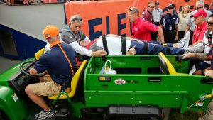 NFL News: Broncos DC Phillips carted off field