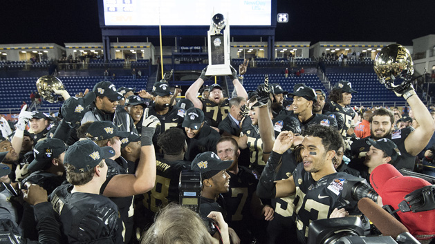 Dec 27, 2016; Annapolis, MD, USA; Wake Forest Demon Deacons offensive lineman Tyler Hayworth (78) (center) hoists the Military Bowl trophy as his teammates celebrate winning the Military Bowl 34-26 over Temple Owls at Navy-Marine Corps. Stadium. Photo Credit: Tommy Gilligan-USA TODAY Sports