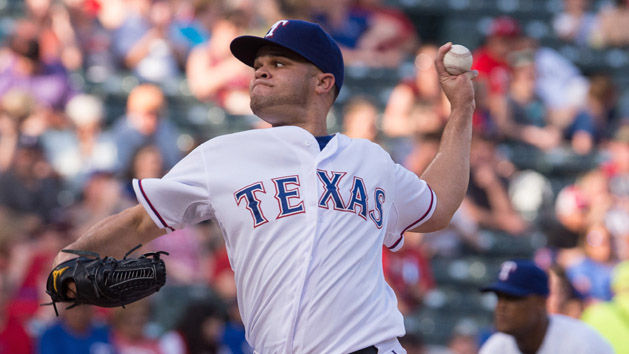 Jun 24, 2015; Arlington, TX, USA; Texas Rangers starting pitcher Wandy Rodriguez (51) pitches against the Oakland Athletics during the first inning at Globe Life Park in Arlington. Mandatory Credit: Jerome Miron-USA TODAY Sports