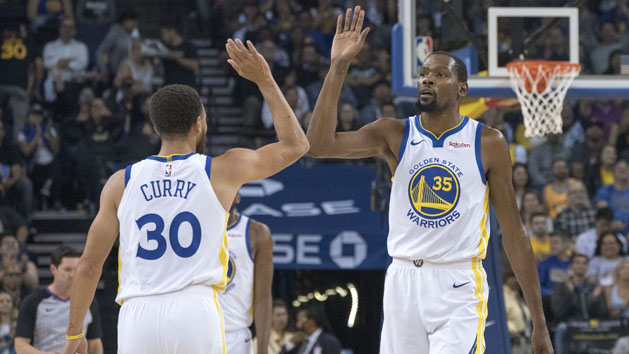 October 8, 2018; Oakland, CA, USA; Golden State Warriors forward Kevin Durant (35) and guard Stephen Curry (30) celebrate against the Phoenix Suns during the first quarter at Oracle Arena. Photo Credit: Kyle Terada-USA TODAY Sports