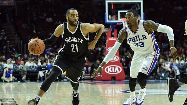 Mar 11, 2016; Philadelphia, PA, USA; Brooklyn Nets guard Wayne Ellington (21) dribbles the ball past Philadelphia 76ers forward Robert Covington (33) during the third quarter of the game at the Wells Fargo Center. The Philadelphia 76ers won 95-89. Photo Credit: John Geliebter-USA TODAY Sports