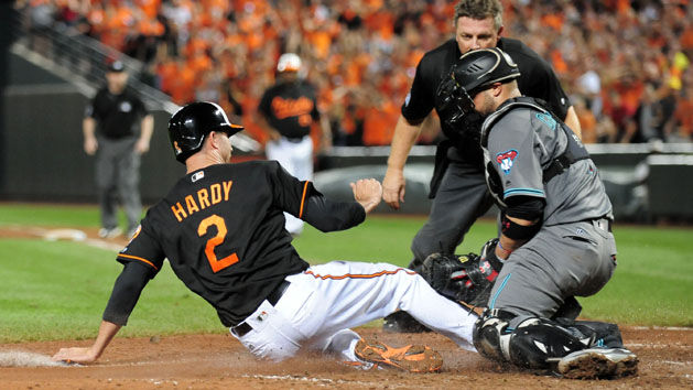 Sep 23, 2016; Baltimore, MD, USA; Baltimore Orioles shortstop J.J. Hardy (2) is tagged out by Arizona Diamondbacks catcher Wellington Castillo (7) in the ninth inning at Oriole Park at Camden Yards. Photo Credit: Evan Habeeb-USA TODAY Sports