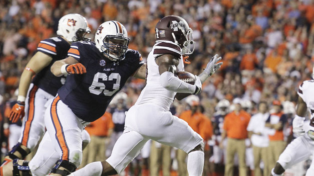 Sep 26, 2015; Auburn, AL, USA; Mississippi State Bulldogs defensive back Will Redmond (2) avoids Auburn Tigers lineman Alex Kozan (63) after intercepting a pass during the first quarter at Jordan Hare Stadium. Mandatory Credit: John Reed-USA TODAY Sports