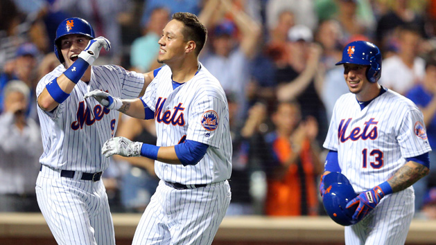 Jul 7, 2016; New York City, NY, USA; New York Mets first baseman Wilmer Flores (4) celebrates his three run home run against the Washington Nationals with New York Mets left fielder Brandon Nimmo (9) and New York Mets shortstop Asdrubal Cabrera (13) during the fifth inning at Citi Field. Mandatory Credit: Brad Penner-USA TODAY Sports