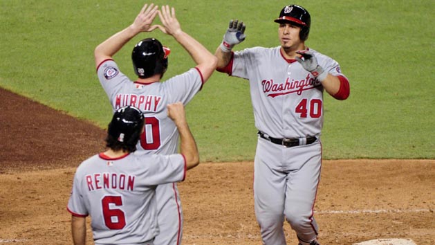 Aug 2, 2016; Phoenix, AZ, USA; Washington Nationals catcher Wilson Ramos (40) celebrates with third baseman Anthony Rendon (6) and second baseman Daniel Murphy (20) after hitting a three run home run in the fifth inning against the Arizona Diamondbacks at Chase Field. Photo Credit: Matt Kartozian-USA TODAY Sports