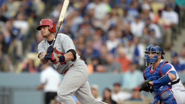 May 15, 2016; Los Angeles, CA, USA; St. Louis Cardinals Yadier Molina (4) hits a pinch hit double in the 7th inning to drive in 2 runs against the Los Angeles Dodgers at Dodger Stadium. Mandatory Credit: Robert Hanashiro-USA TODAY Sports