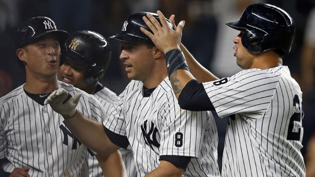 Sep 9, 2016; Bronx, NY, USA; New York Yankees first baseman Mark Teixeira (25) celebrates hitting a grand slam with Gary Sanchez (24), Rob Refsnyder (38) and Starlin Castro (14) during the fourth inning against the Tampa Bay Rays at Yankee Stadium. Photo Credit: Adam Hunger-USA TODAY Sports
