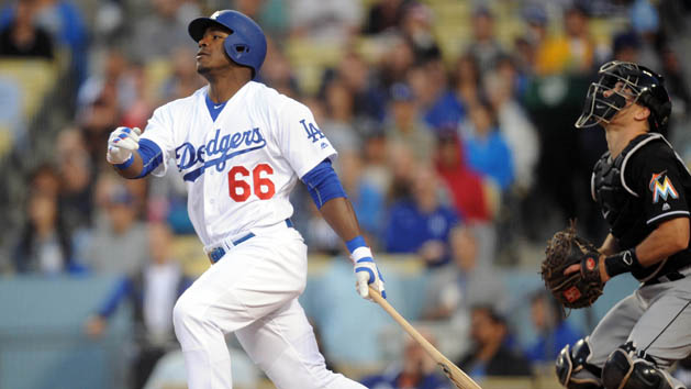 April 28, 2016; Los Angeles, CA, USA; Los Angeles Dodgers right fielder Yasiel Puig (66) hits an RBI single in the first inning against Miami Marlins at Dodger Stadium. Mandatory Credit: Gary A. Vasquez-USA TODAY Sports