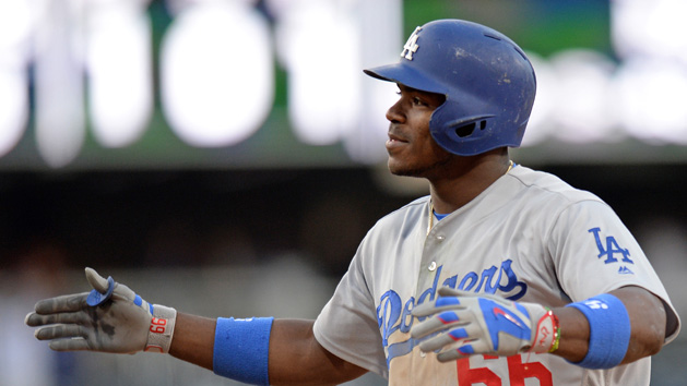 May 22, 2016; San Diego, CA, USA; Los Angeles Dodgers right fielder Yasiel Puig (66) reacts after hitting a two RBI single during the 17th inning against the San Diego Padres at Petco Park. Mandatory Credit: Jake Roth-USA TODAY Sports