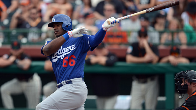 Mar 6, 2016; Scottsdale, AZ, USA; Los Angeles Dodgers right fielder Yasiel Puig (66) swings at a pitch against the San Francisco Giants during the first inning at Scottsdale Stadium. Mandatory Credit: Joe Camporeale-USA TODAY Sports